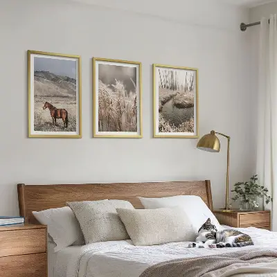 Wall art set horses in a grassy landscape with a stream