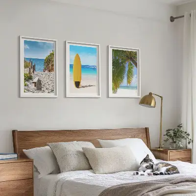 Set of 3 framed wall art pieces featuring holiday beaches, ocean waves, and palm trees