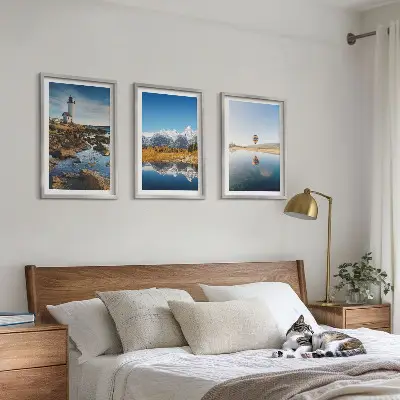 Wall art set featuring views of nature with a lighthouse, mountains, and a balloon