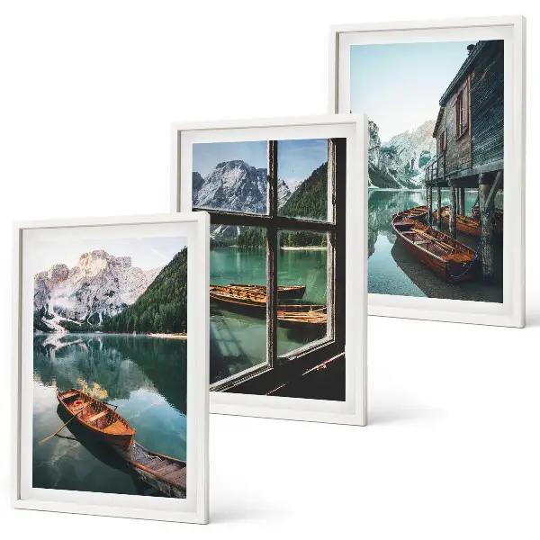 Three-piece mountain lake boats wall art featuring a landscape with a house