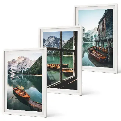 Three-piece mountain lake boats wall art featuring a landscape with a house