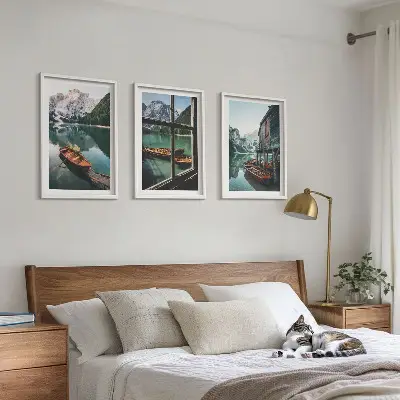 Three-piece mountain lake boats wall art featuring a landscape with a house