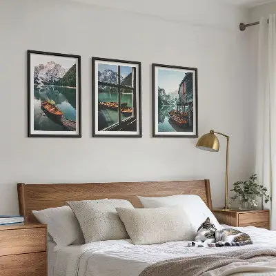 Three-piece mountain lake boats wall art featuring a landscape with a house