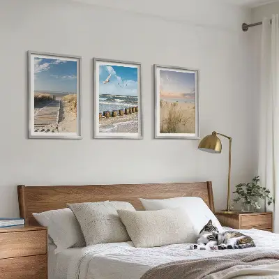 Wall art set featuring a coastal beach scene with sand, waves, sky, and birds