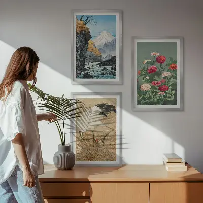 Set of 3 framed wall art pieces featuring a mountain landscape with a river, flowers, and cranes