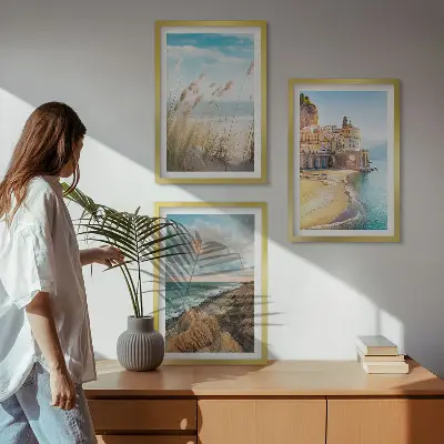 Set of 3 framed wall art pieces featuring beach cliffs and cityscapes