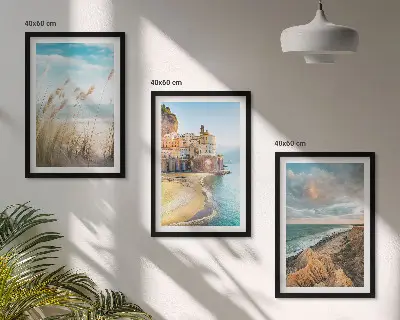 Set of 3 framed wall art pieces featuring beach cliffs and cityscapes