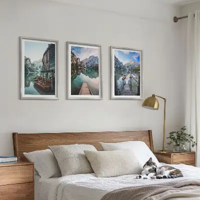 Three-piece wall art set featuring a lake with mountains and wooden boats
