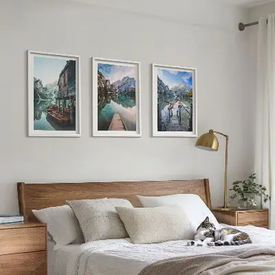 Three-piece wall art set featuring a lake with mountains and wooden boats
