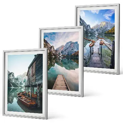 Three-piece wall art set featuring a lake with mountains and wooden boats