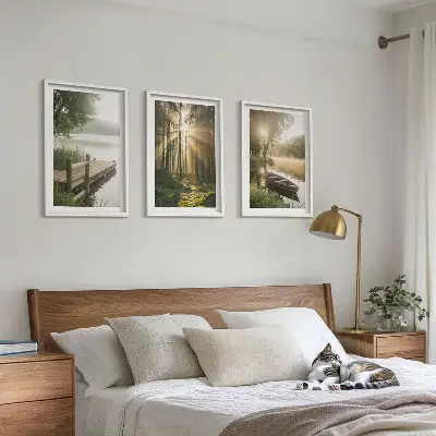 Set of 3 framed wall art pieces featuring a morning fog over a lake with a forest and a boat