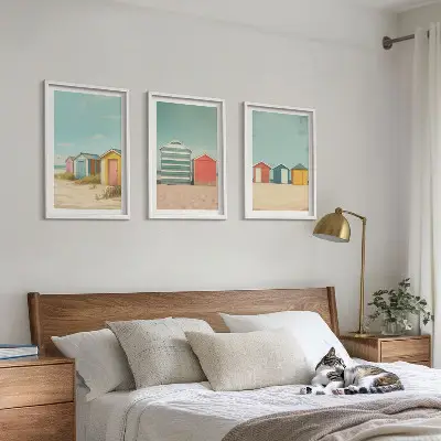 Three-piece wall art set colorful houses beach and sun scene