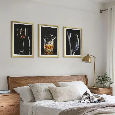 Set of 3 framed wall art pieces featuring glasses of wine and whiskey on a black background
