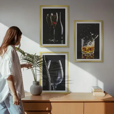 Set of 3 framed wall art pieces featuring glasses of wine and whiskey on a black background