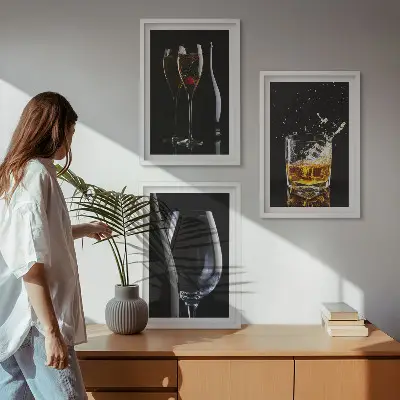 Set of 3 framed wall art pieces featuring glasses of wine and whiskey on a black background