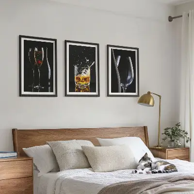 Set of 3 framed wall art pieces featuring glasses of wine and whiskey on a black background