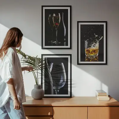 Set of 3 framed wall art pieces featuring glasses of wine and whiskey on a black background