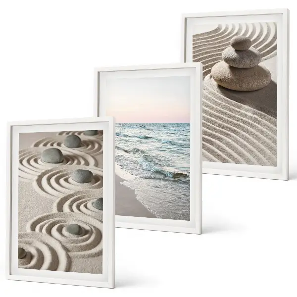 Set of 3 framed wall art pieces featuring waves, sand, water, and beach stones