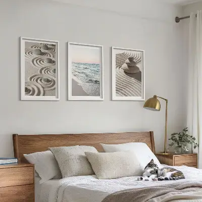 Set of 3 framed wall art pieces featuring waves, sand, water, and beach stones