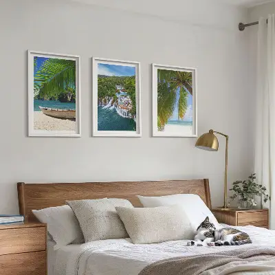 Three-piece wall art set featuring beach, boat, waterfall, and palm tree scenery