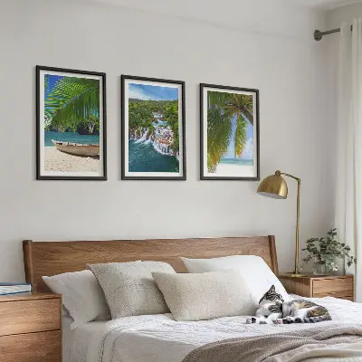Three-piece wall art set featuring beach, boat, waterfall, and palm tree scenery