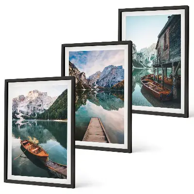 Set of 3 framed wall art pieces featuring a lake with mountains, boats, and a cottage