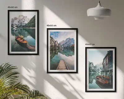 Set of 3 framed wall art pieces featuring a lake with mountains, boats, and a cottage