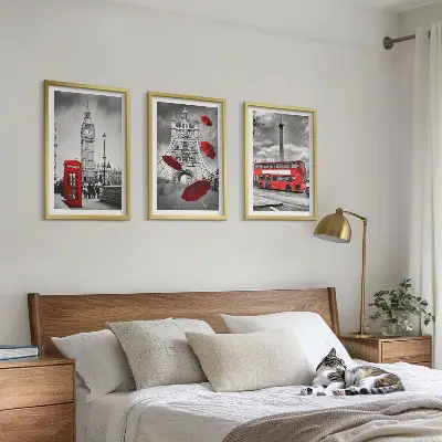 Set of 3 framed wall art pieces featuring a red umbrella booth and a London bus