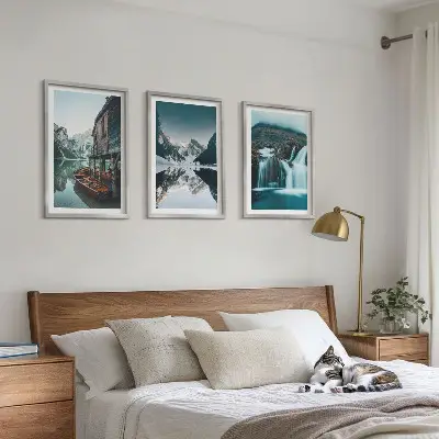 Set of 3 framed wall art pieces featuring mountain landscapes with waterfalls and lakes