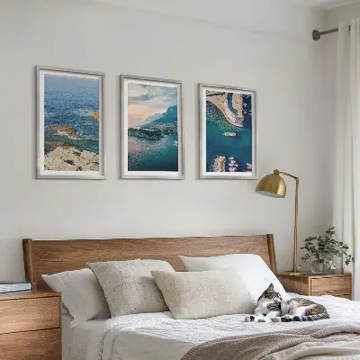 Set of 3 framed wall art pieces featuring sea views, cliffs, and ports