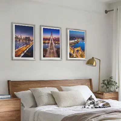 Three-piece wall art cities at night featuring bridges and rivers
