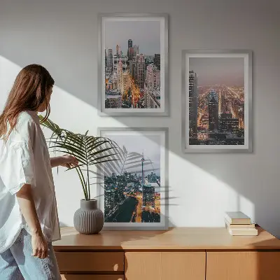 Set of 3 framed wall art pieces featuring city skyscrapers at night with lights