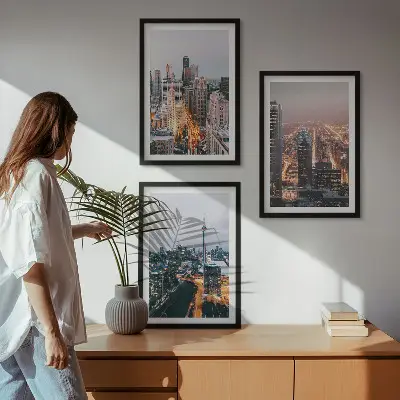 Set of 3 framed wall art pieces featuring city skyscrapers at night with lights