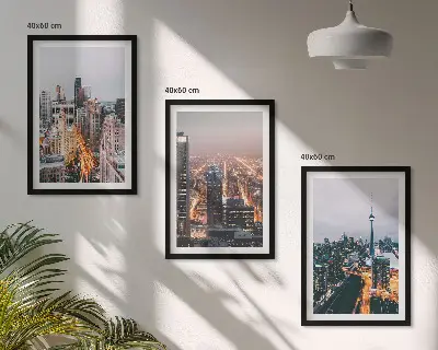Set of 3 framed wall art pieces featuring city skyscrapers at night with lights