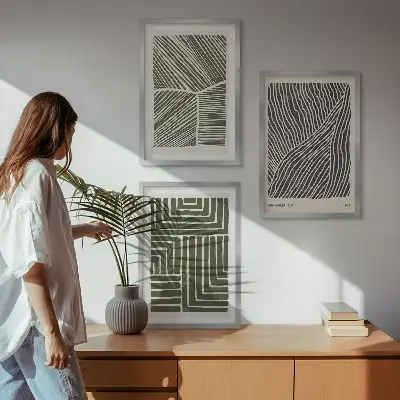 Set of 3 framed wall art pieces with green patterned lines and shapes
