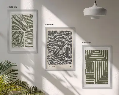 Set of 3 framed wall art pieces with green patterned lines and shapes