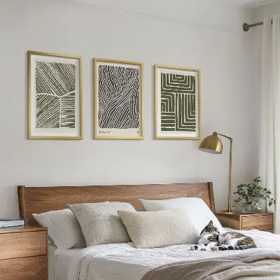 Set of 3 framed wall art pieces with green patterned lines and shapes