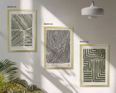 Set of 3 framed wall art pieces with green patterned lines and shapes