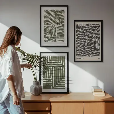 Set of 3 framed wall art pieces with green patterned lines and shapes