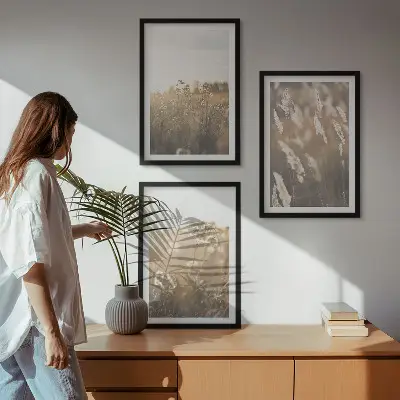 Set of 3 framed landscape wall art pieces featuring grass and flowers with a warm aesthetic
