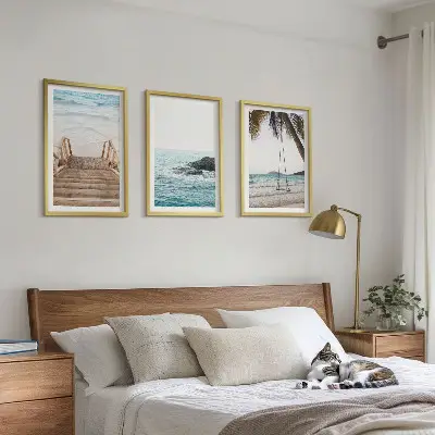 Set of 3 framed wall art pieces featuring a seaside staircase with a swing