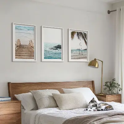 Set of 3 framed wall art pieces featuring a seaside staircase with a swing