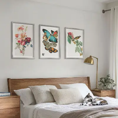 Three-piece wall art set featuring a pastel floral butterfly and bird design