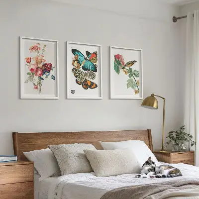 Three-piece wall art set featuring a pastel floral butterfly and bird design