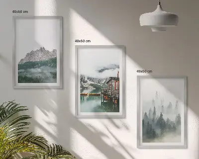 Set of 3 framed wall art pieces featuring mountains, a lake, a cottage, and fog