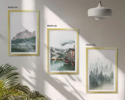 Set of 3 framed wall art pieces featuring mountains, a lake, a cottage, and fog