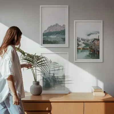 Set of 3 framed wall art pieces featuring mountains, a lake, a cottage, and fog