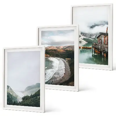 Set of 3 framed wall art pieces featuring mountains, beach, clouds, and water