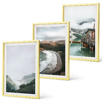 Set of 3 framed wall art pieces featuring mountains, beach, clouds, and water