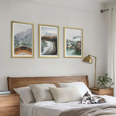 Three-piece mountain and lake landscape wall art featuring a boat on a beach